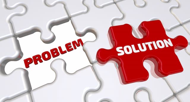 White puzzle pieces in the background, with an empty space labelled 'Problem' and a red puzzle piece labelled 'Solution'